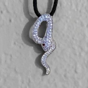 Bejeweled 925 Silver Serpent pendant hangs from twisted Leather cord. Dazzling!